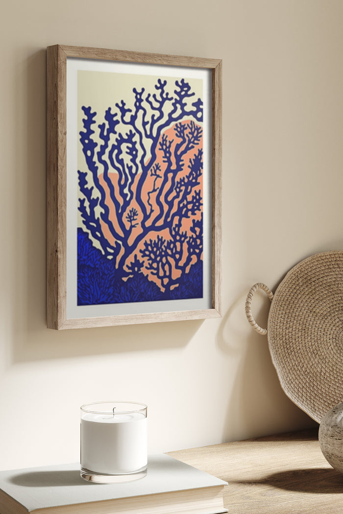 Abstract framed artwork of a stylized coral reef using orange and blue color palette on wall