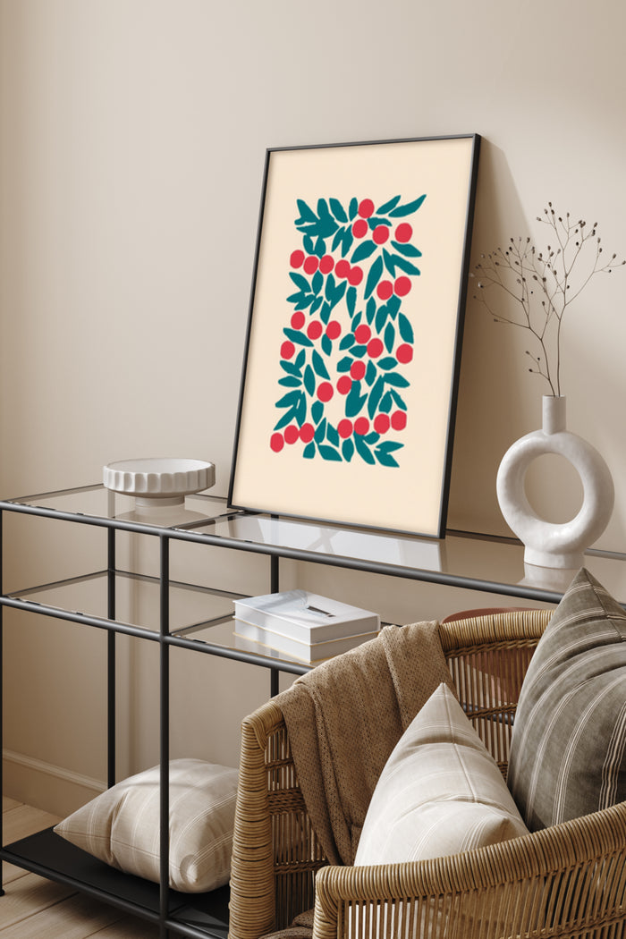 Stylized red and green fruit pattern poster framed on wall above chic metal console table with decorative vase and books in contemporary living room