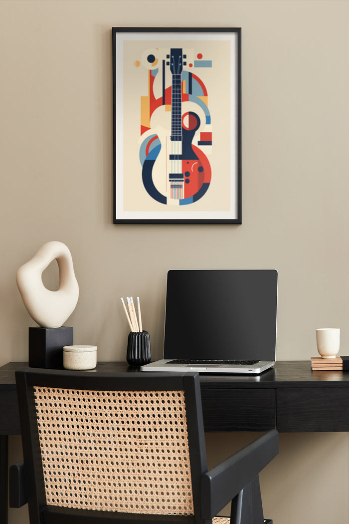 Abstract geometric musical instrument poster art, featuring guitar and modern shapes, displayed above a home office desk with a laptop