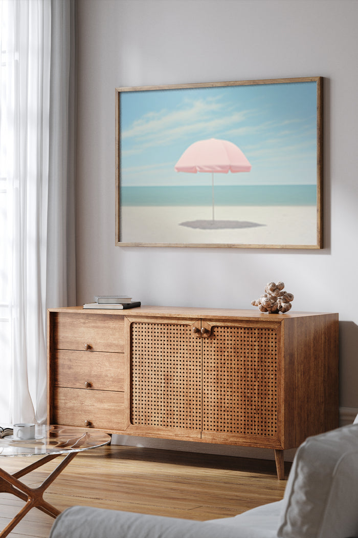 Modern living room interior with framed poster of a beach scene featuring a pink umbrella