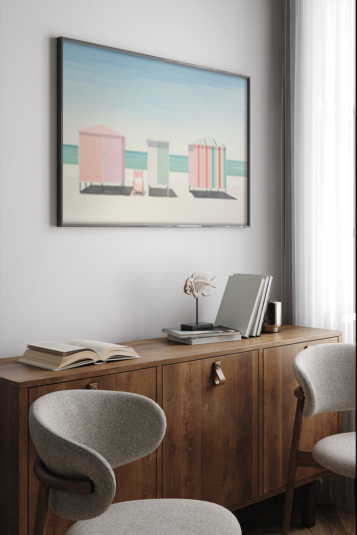 Modern artistic poster of colorful beach huts by the seaside hanging in a contemporary room
