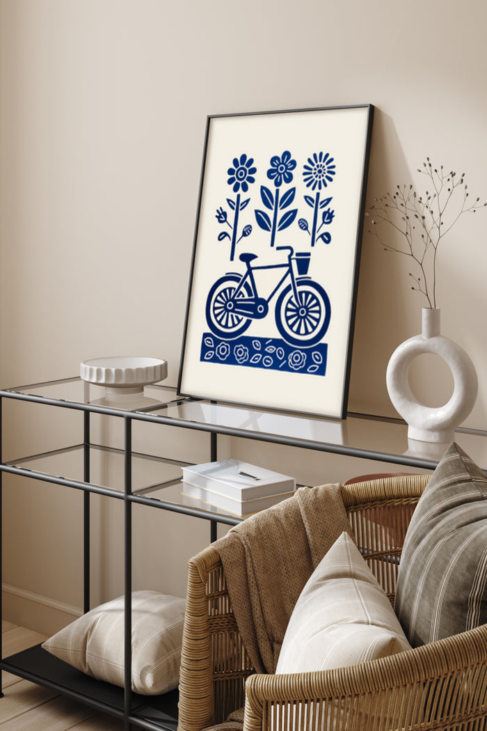 Blue and white folk art style poster of a bicycle surrounded by flowers in a modern home interior
