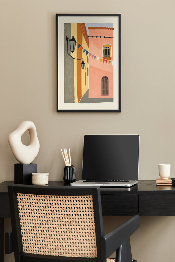 Abstract colorful cityscape poster in a frame above a modern home office desk with decorative items