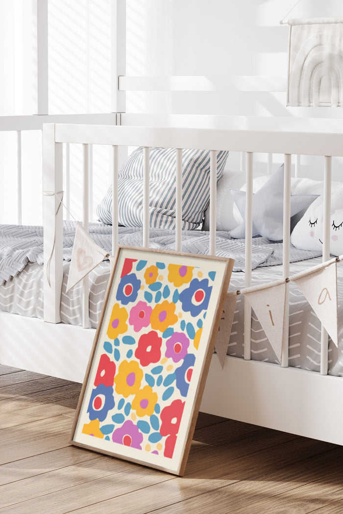 Bright and colorful floral poster leaning against a white nursery crib, adding vibrant art to kids bedroom decor