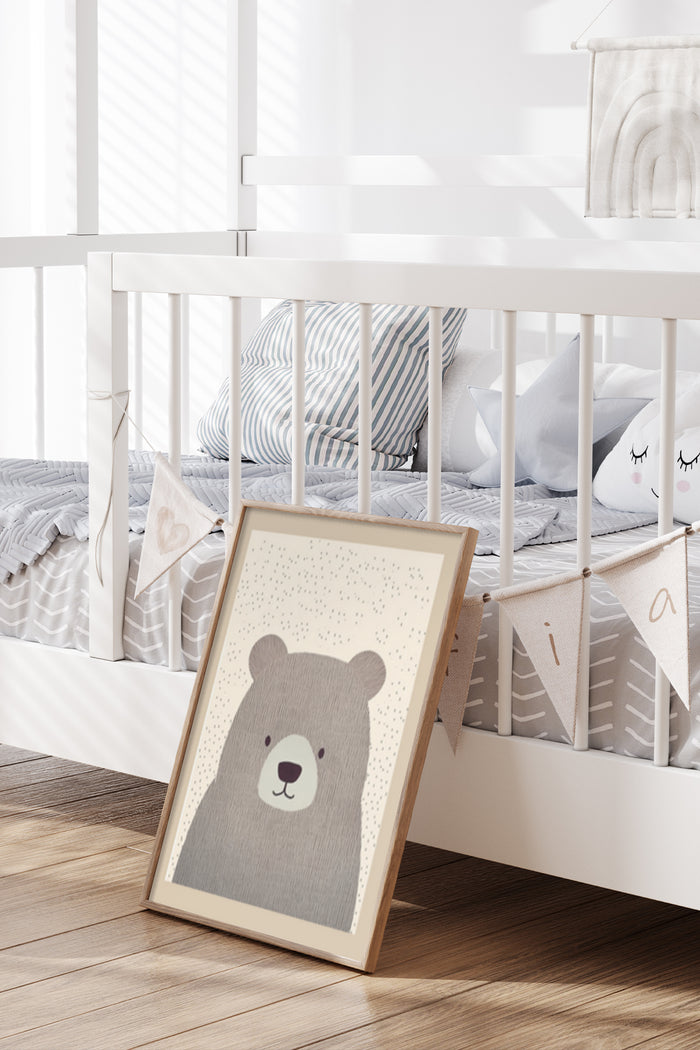 Cute bear poster leaning against a white crib in a modern nursery room setting