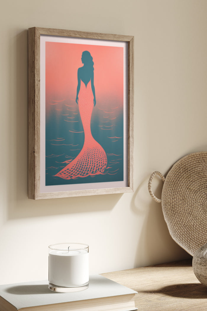 Mermaid silhouette against ocean and sunset background framed poster in a modern interior
