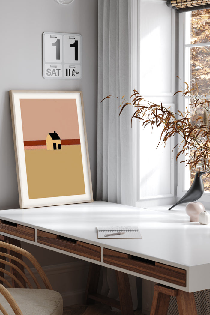 Minimalist landscape artwork featuring a small house on the horizon with pastel colors, displayed in a modern interior setting