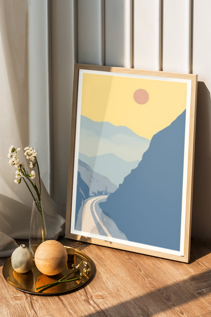 A minimalist mountain landscape poster framed and displayed in a modern home interior setting