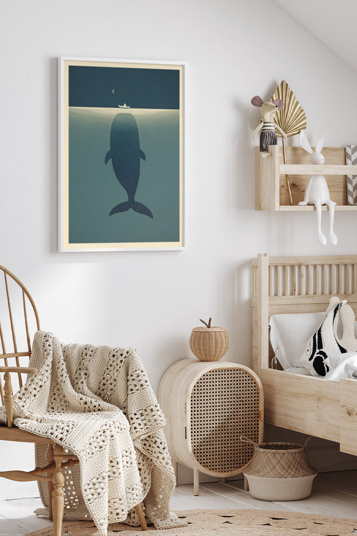 Stylish minimalist poster of a whale silhouette under a night sky with moon, mounted on a white wall in a cozy interior setting
