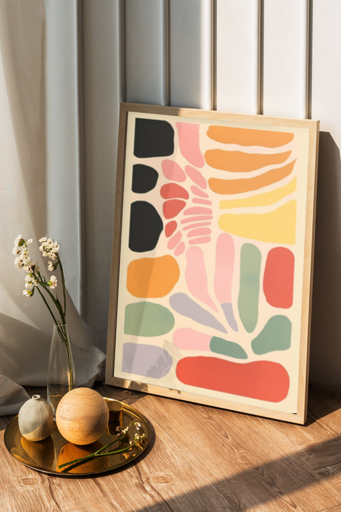 Colorful modern abstract artwork framed poster displayed in a cozy home setting with decorative items