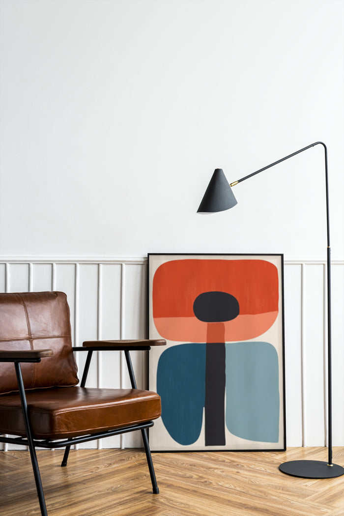 Contemporary abstract geometric artwork poster displayed in stylish living room with leather chair and floor lamp