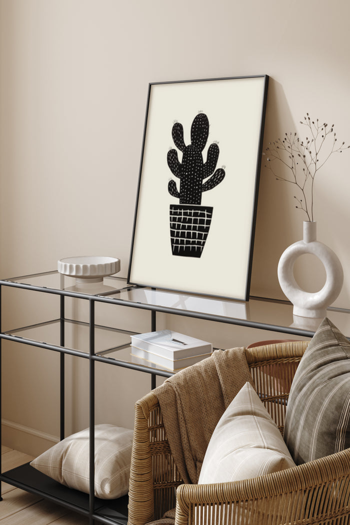 Minimalist black and white cactus illustration poster framed in a stylish living room