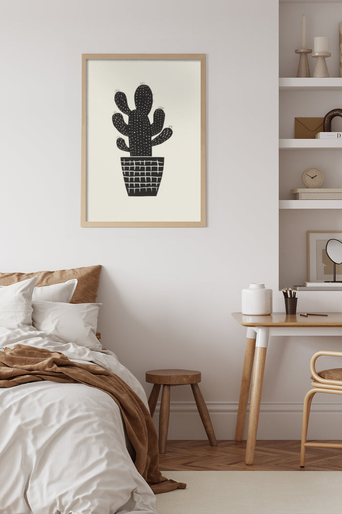 Contemporary black and white cactus artwork framed on bedroom wall