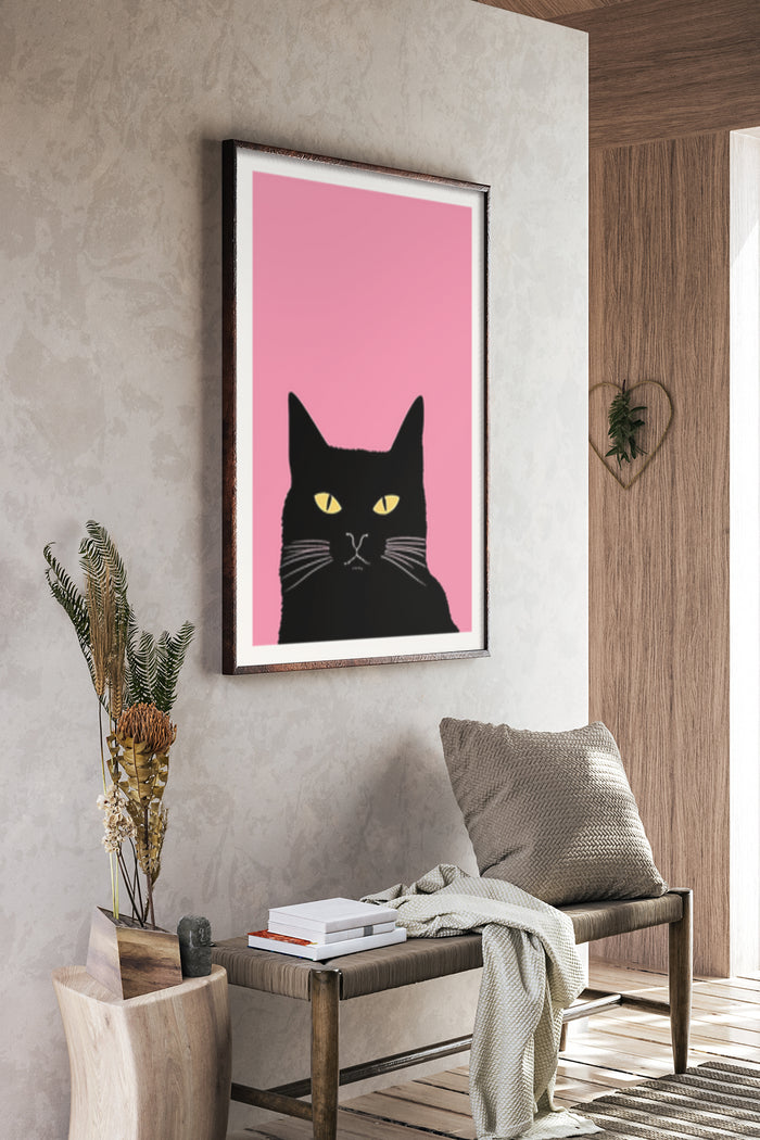 Contemporary black cat illustration poster with a vibrant pink background in a stylish interior setting
