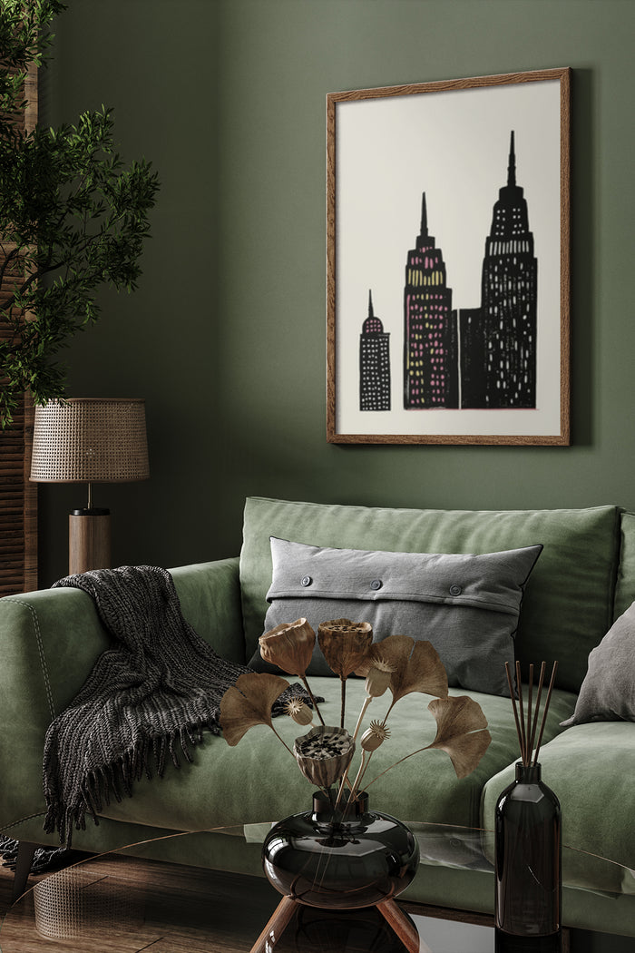 Stylized modern cityscape artwork with skyscrapers in a framed poster above a green sofa in a cozy living room setting