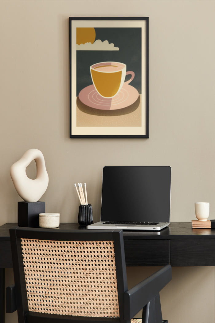 Stylish coffee cup poster with abstract sun and clouds hanging above a home office desk