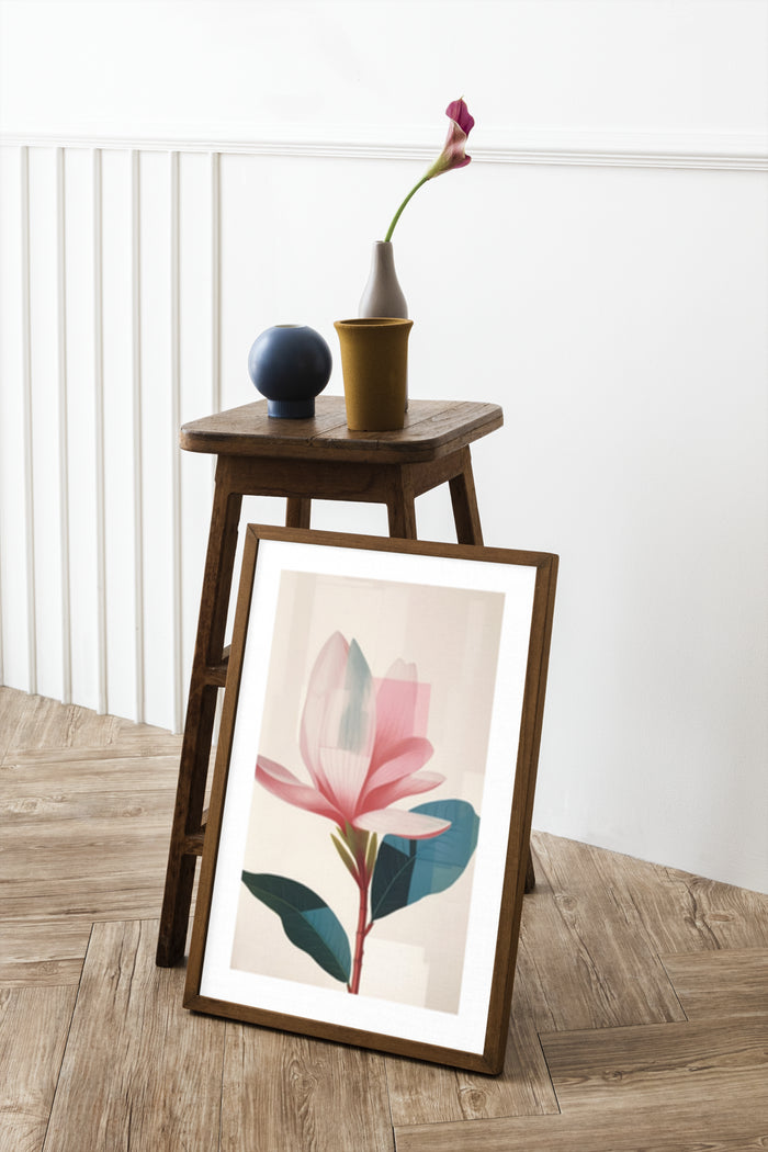 Contemporary pink flower poster artwork in wooden frame placed on the floor next to vintage stool with vase and flower