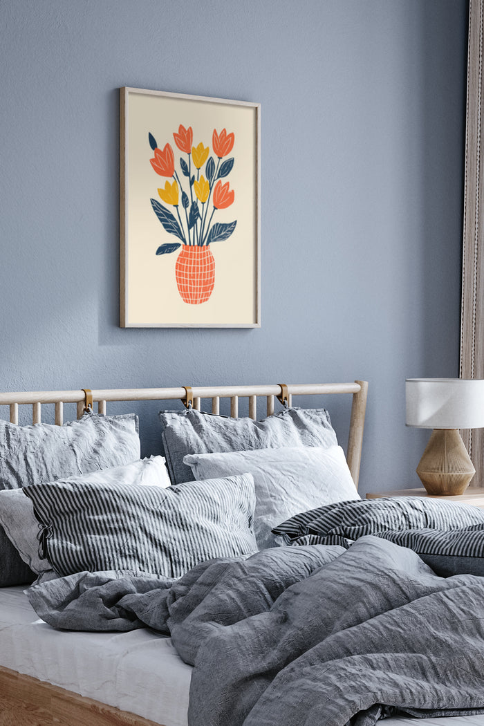 Modern floral artwork with orange and yellow tulips in geometric vase hung over bedroom wall