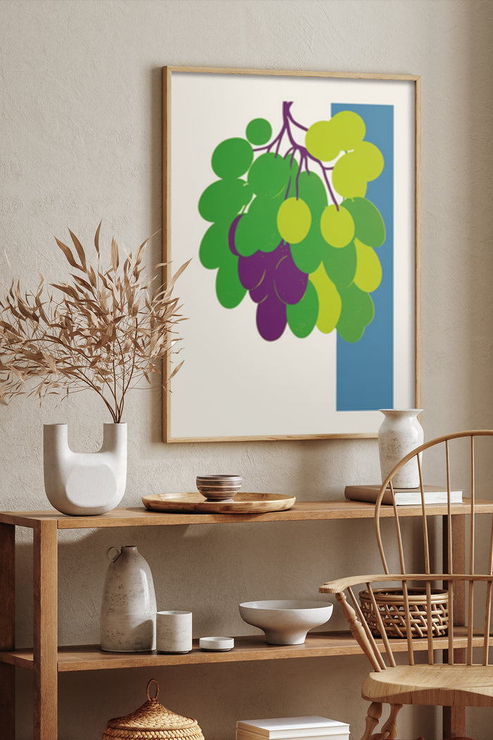 Contemporary grape bunch illustration poster framed on a textured wall above wooden shelves with ceramic decorations