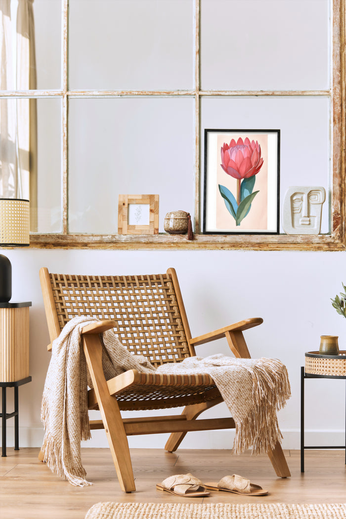 Stylish interior design featuring a chair with a cozy throw blanket and a framed pink tulip artwork on the wall