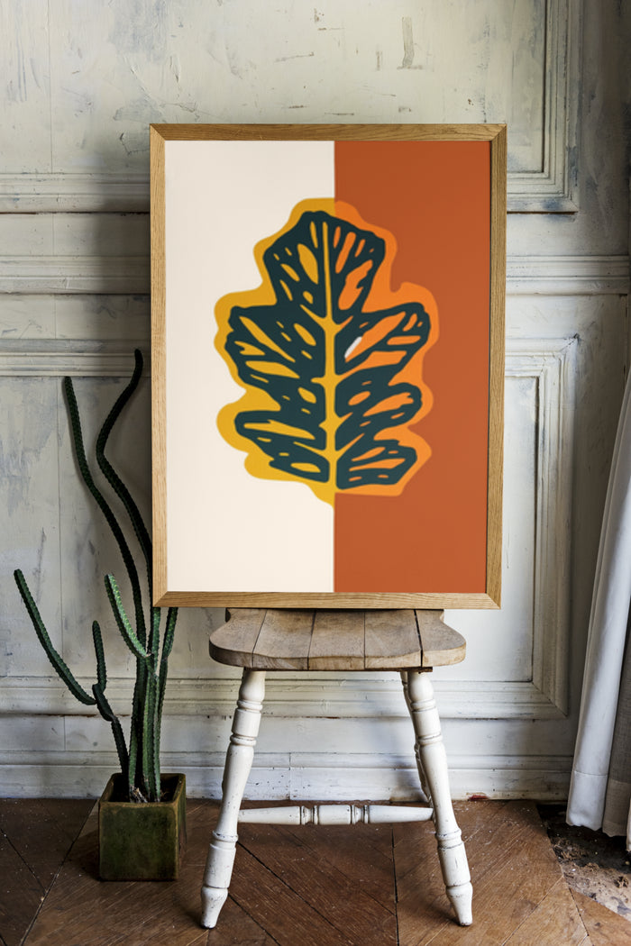 Modern Leaf Artwork Poster in Stylish Vintage Room with Rustic Wooden Table and Cactus Plant