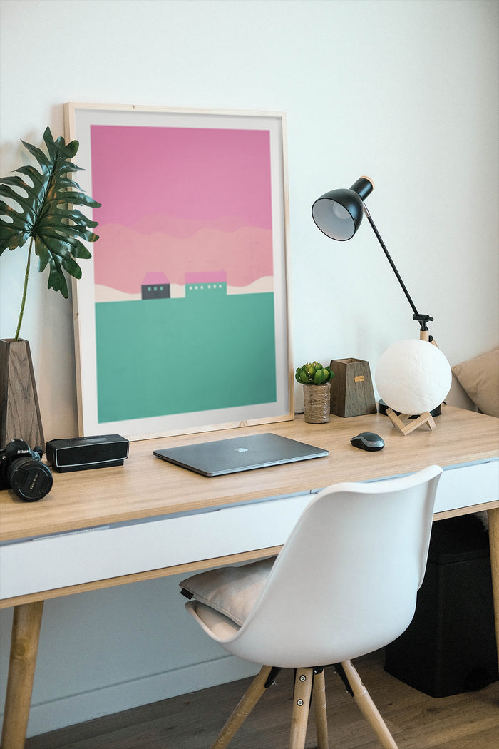Stylish pink and green minimalist landscape art poster framed in a modern home office environment