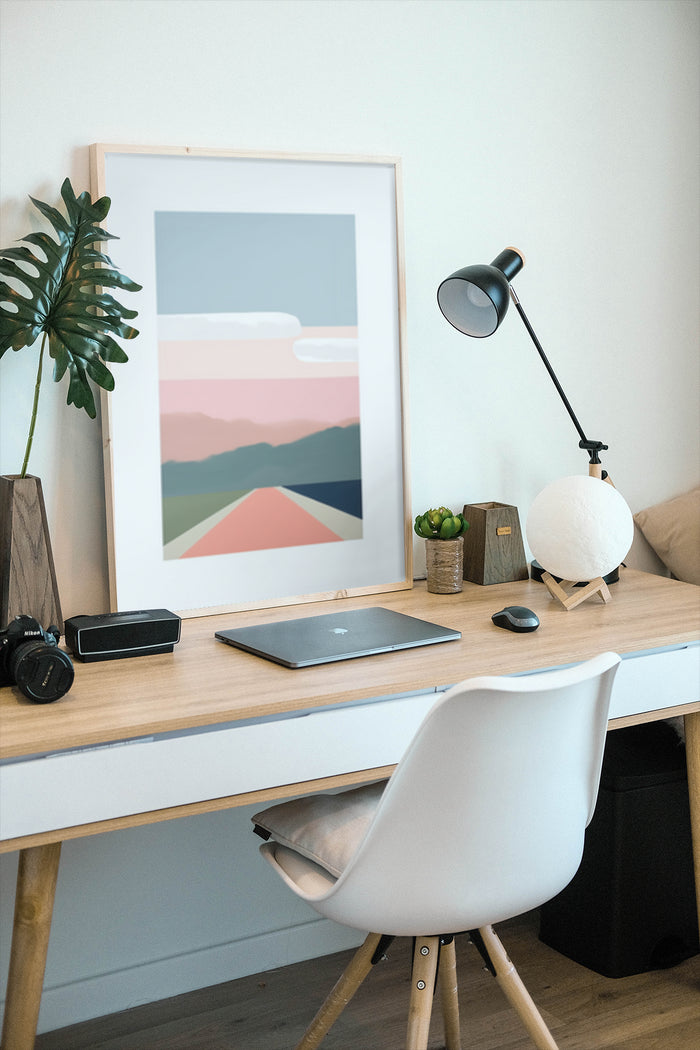 Stylish modern minimalist landscape poster framed in a home office with trendy decor and furnishings