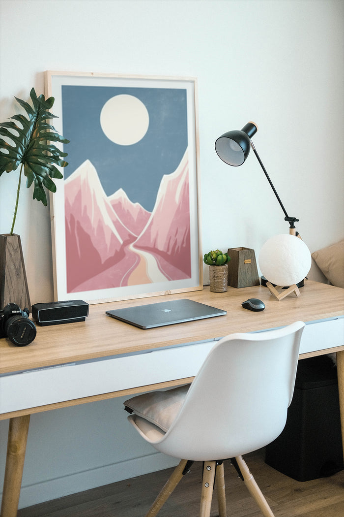 Stylish minimalist mountain range poster in a modern home office setup with desk and white chair