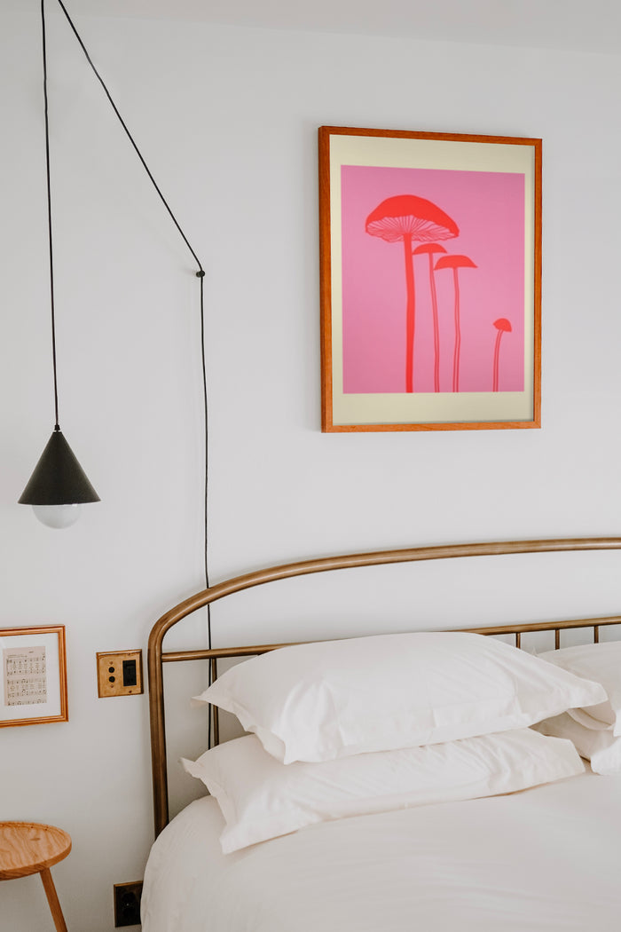 Minimalist mushroom poster in warm pink tones framed in a bedroom setting