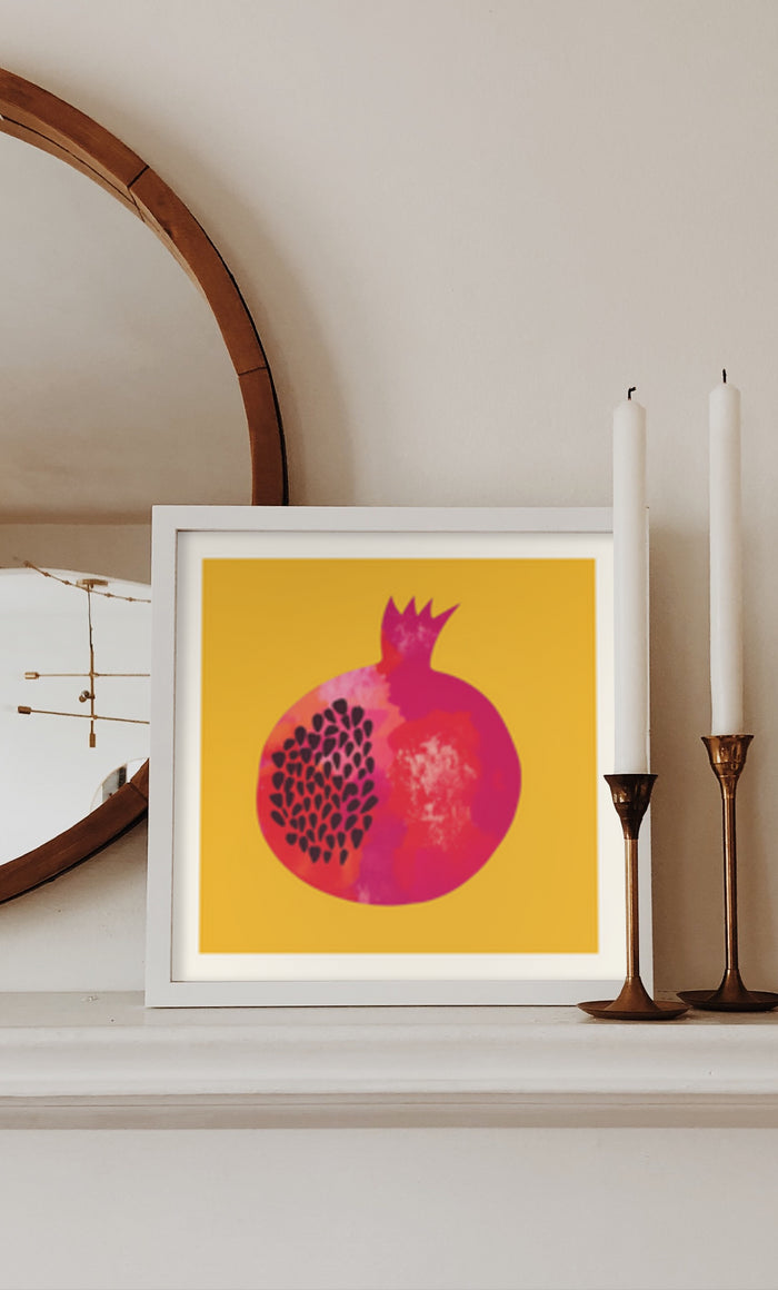 Contemporary pomegranate illustration poster on yellow background displayed on home wall