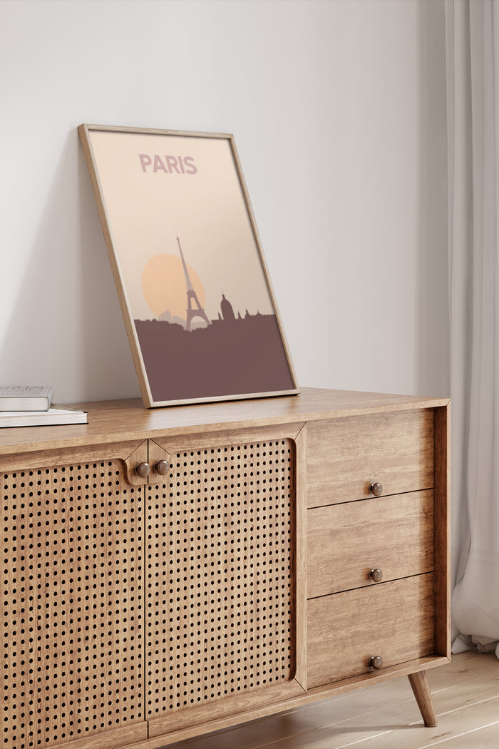Minimalist Paris travel poster featuring the Eiffel Tower silhouette against a sunset backdrop in a modern interior