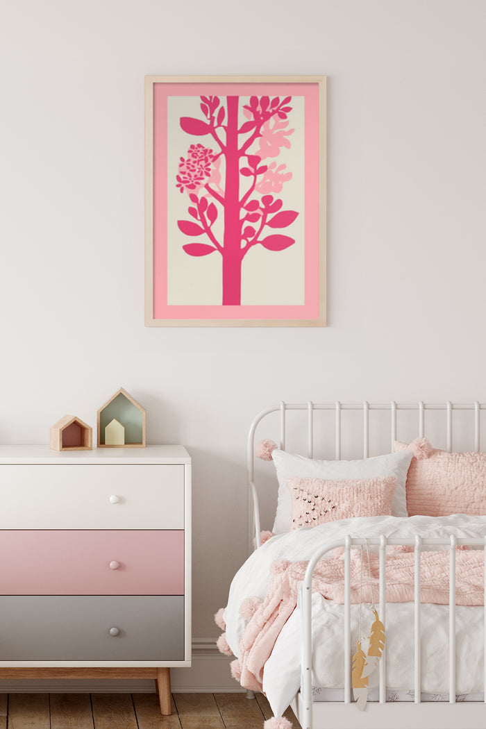 Stylish pink and cream tree illustration poster framed on a bedroom wall above a modern dresser with decorative items