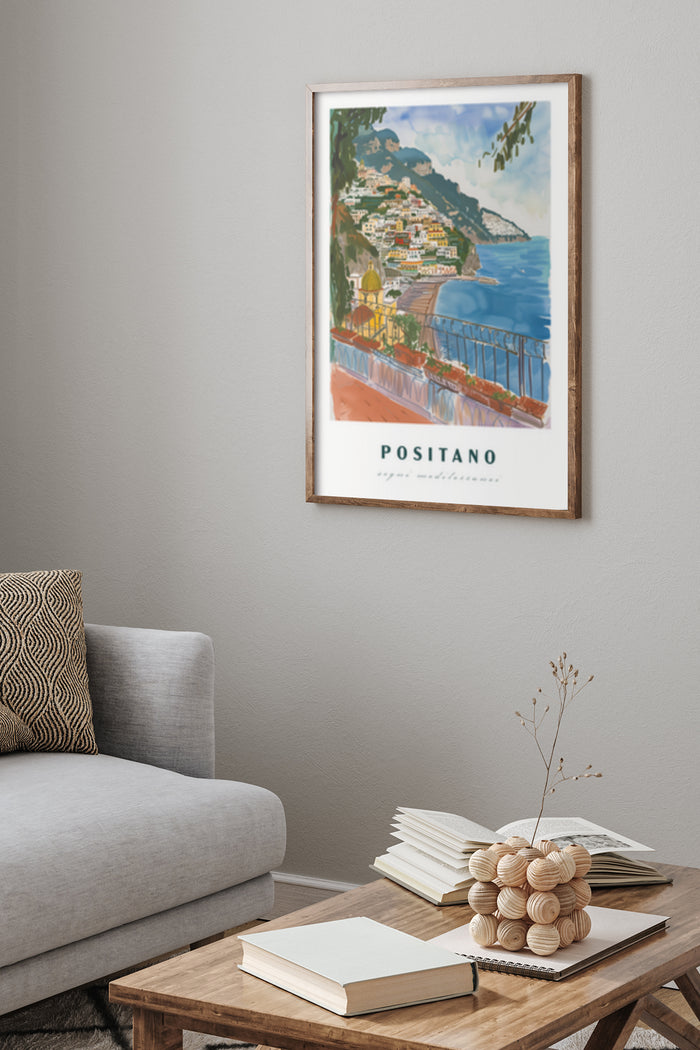Framed travel poster of Positano on wall depicting scenic Mediterranean coastline