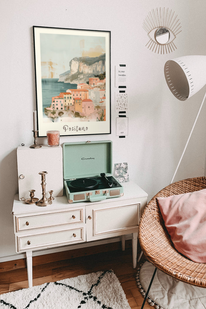 Vintage Positano travel poster in a stylish interior setting with turntable and decorative elements