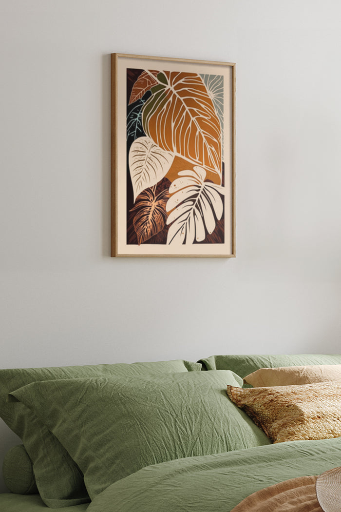Warm toned tropical leaf artwork poster in a bedroom setting