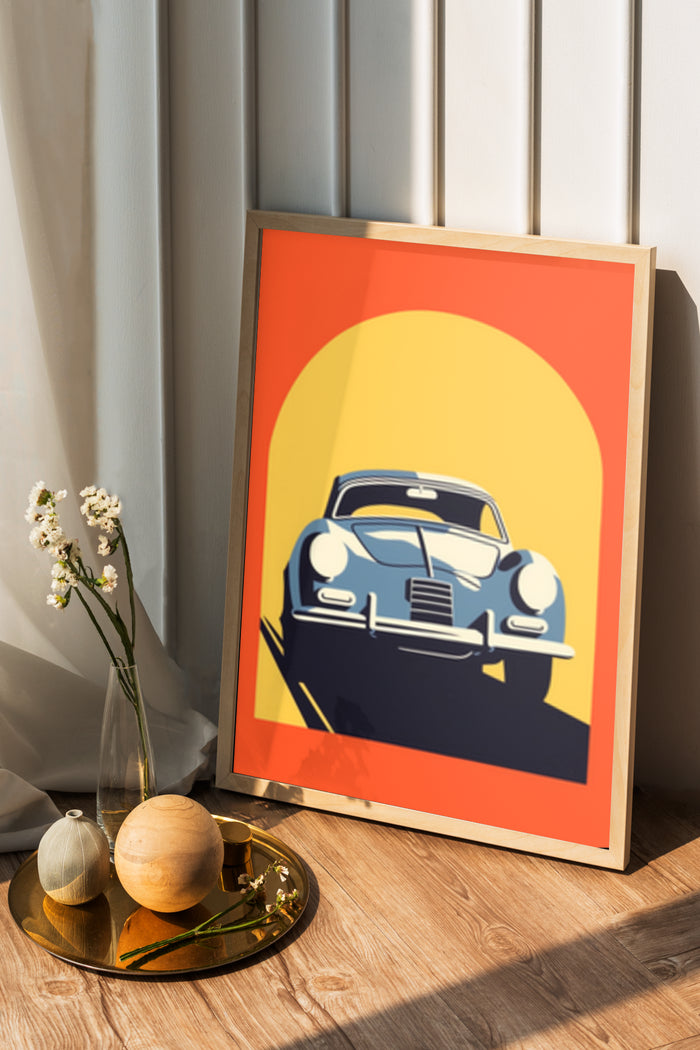 Vintage blue car graphic poster in wooden frame displayed in home interior with decorative items on a tray