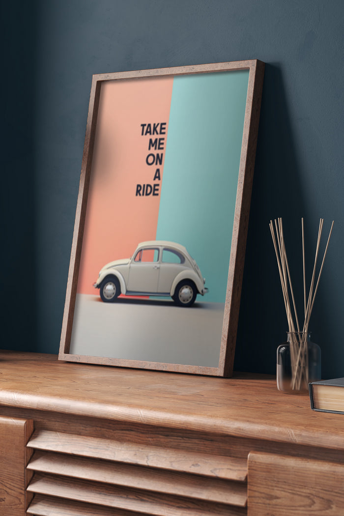 Vintage car poster with 'Take Me on a Ride' text in a frame on a wooden desk