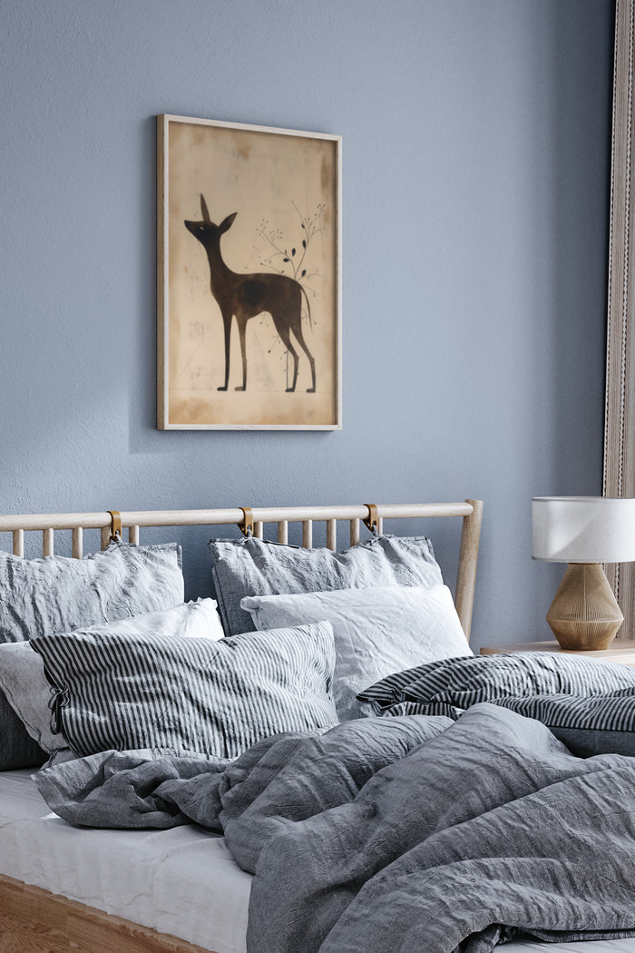 Vintage deer silhouette poster with botanical elements in bedroom interior design