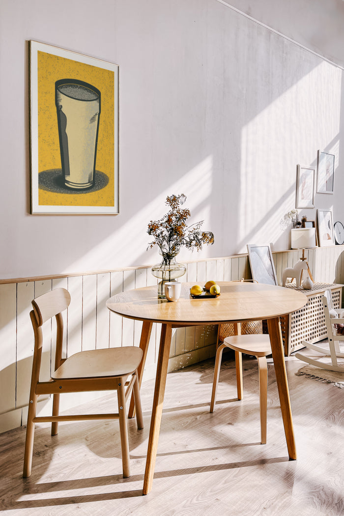 Contemporary dining room with vintage glass artwork on the wall