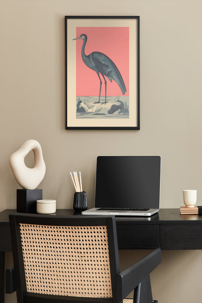 Stylish vintage poster with heron illustration hanging above a modern home office desk setup