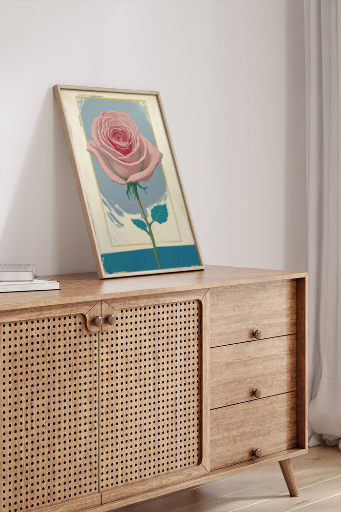 Vintage styled poster of a pink rose on display in a modern interior setting