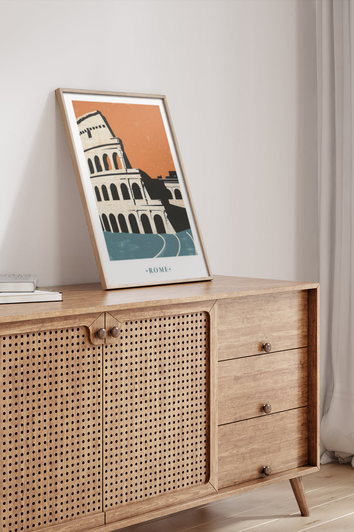 Framed vintage travel poster of Rome with Colosseum illustration on a wooden sideboard