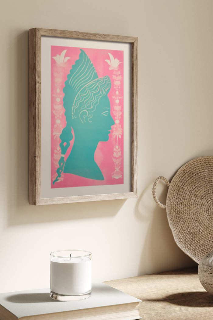 Vintage style classical bust poster in a wooden frame placed on a beige wall next to decorative objects