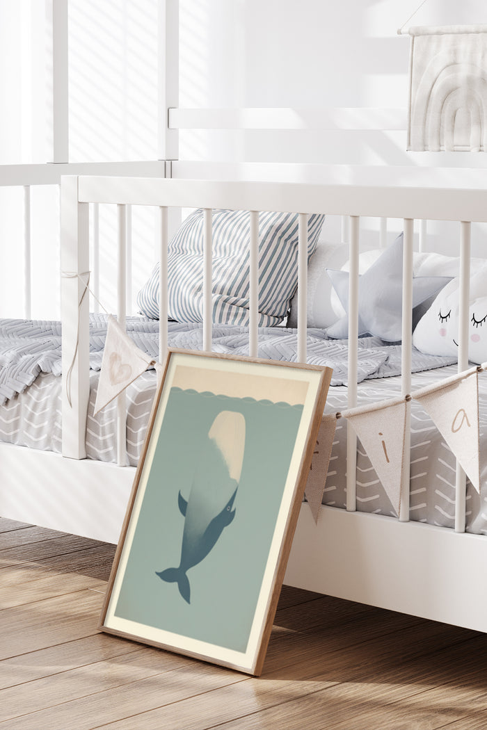 Minimalist whale illustration poster leaning against a white crib in a modern nursery room setting