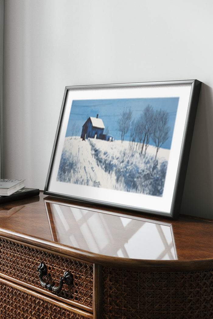 Framed winter landscape painting poster displayed on home office desk