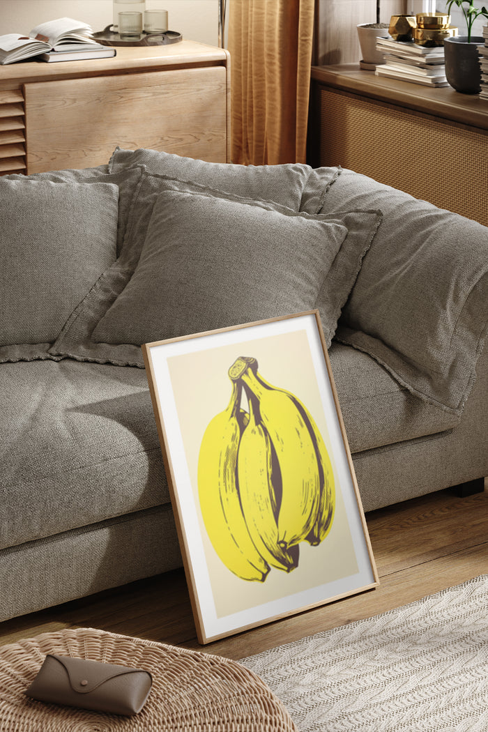 Illustration of yellow bananas on a poster, artistically displayed in a cozy home environment with neutral tones