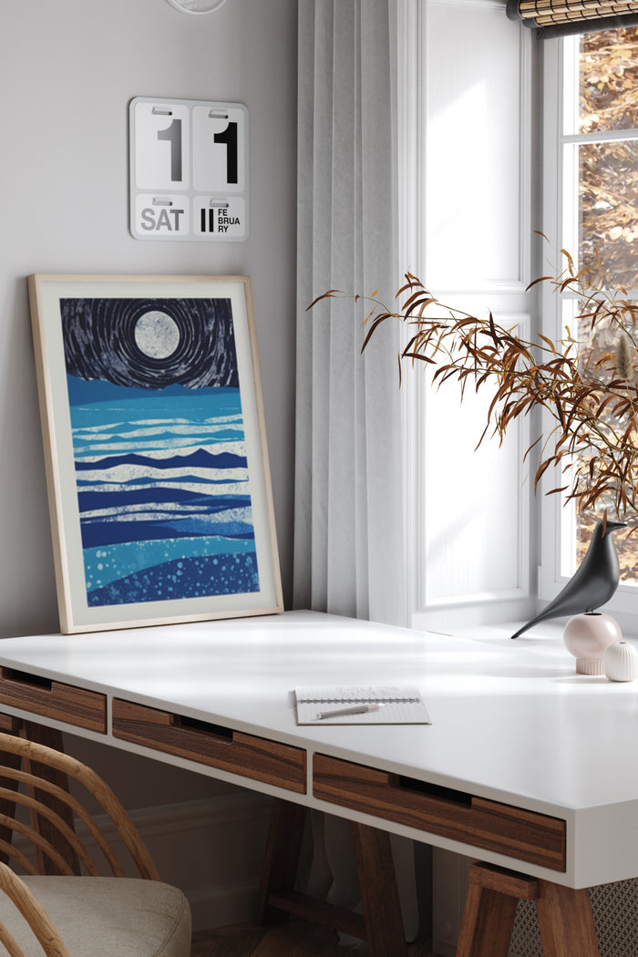 Modern home office with framed abstract sea and moon painting, stylish interior design with minimalistic decor