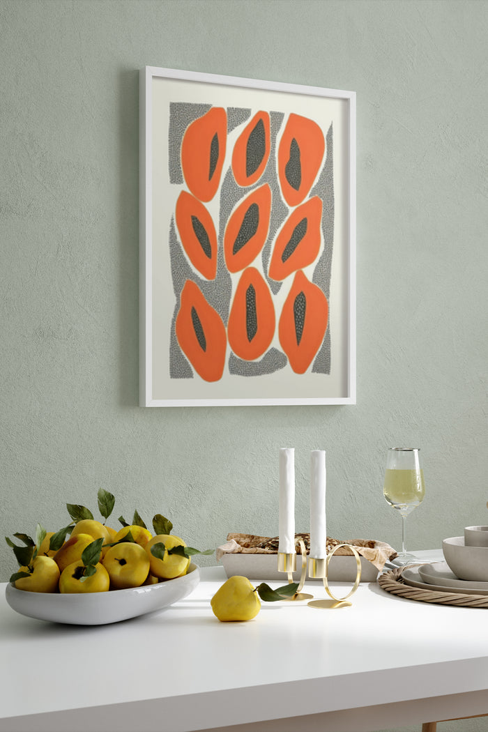Abstract art poster with orange shapes and black seeds design in a modern dining room