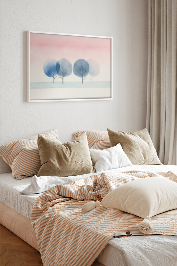 Abstract pastel-toned three trees artwork in a frame above the bed with striped and textured bedding in stylish bedroom interior