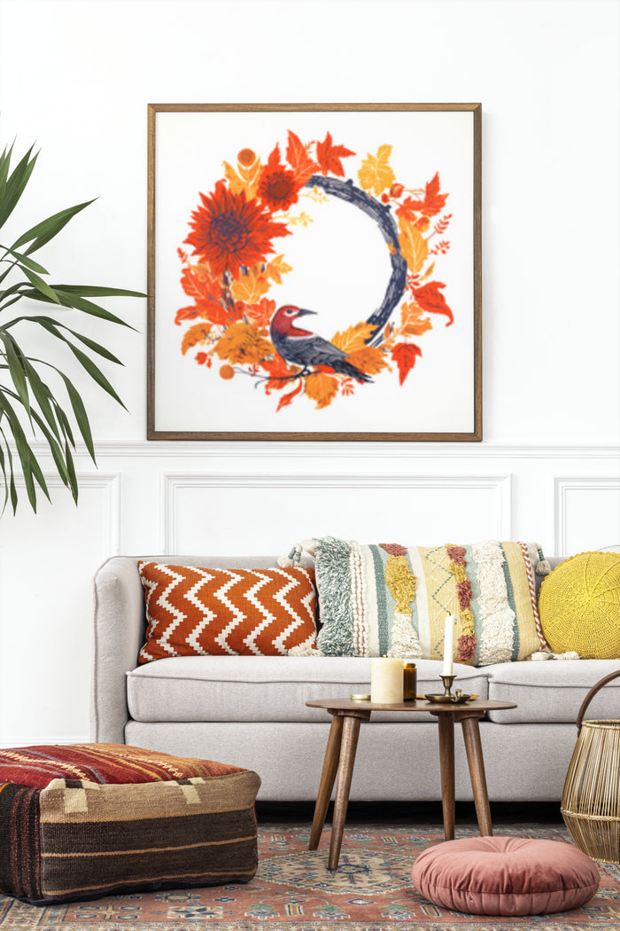 Autumn leaves and bird wreath artwork displayed in a contemporary living room setting